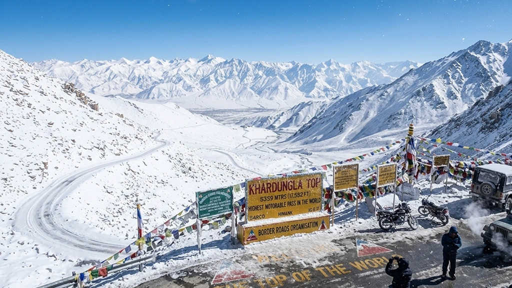 Khardung La Pass Khardung La Pass covered in snow with prayer flags and mountain road